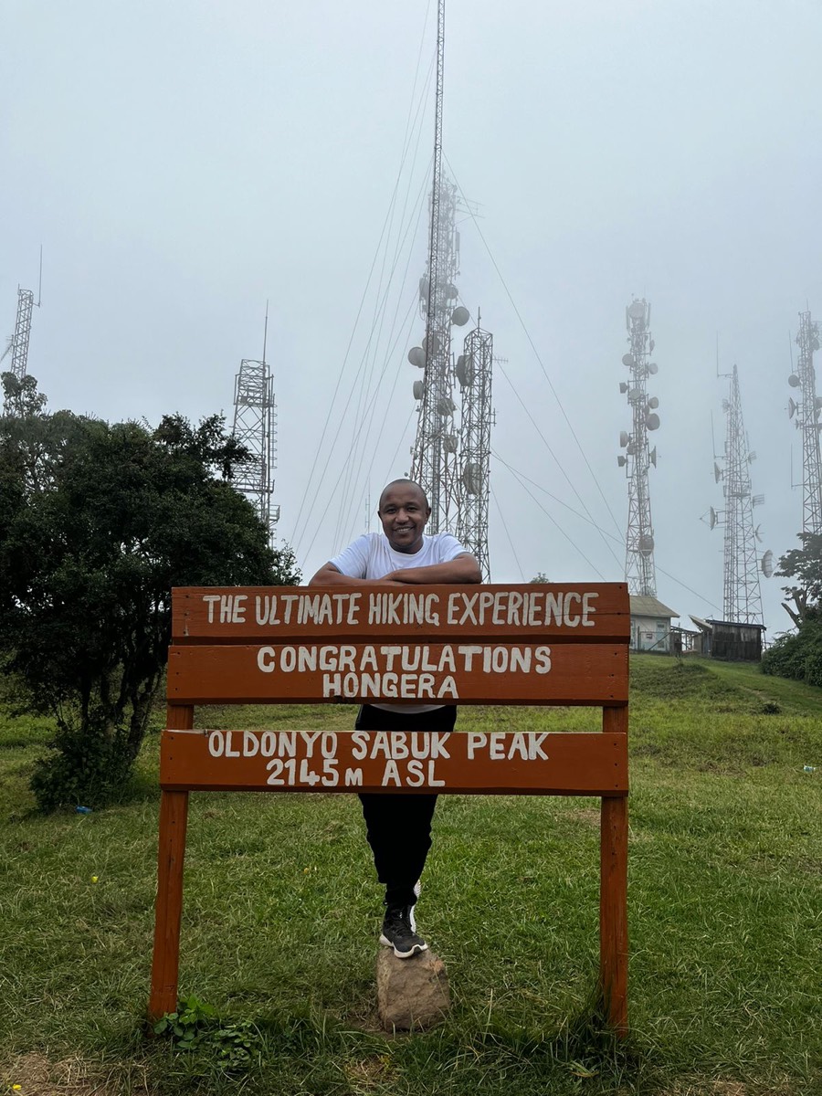 Sammy at the summit of Oldonyo Sabuk after a hike